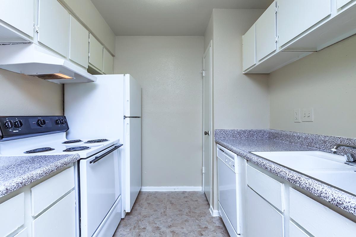 a kitchen with a stove top oven