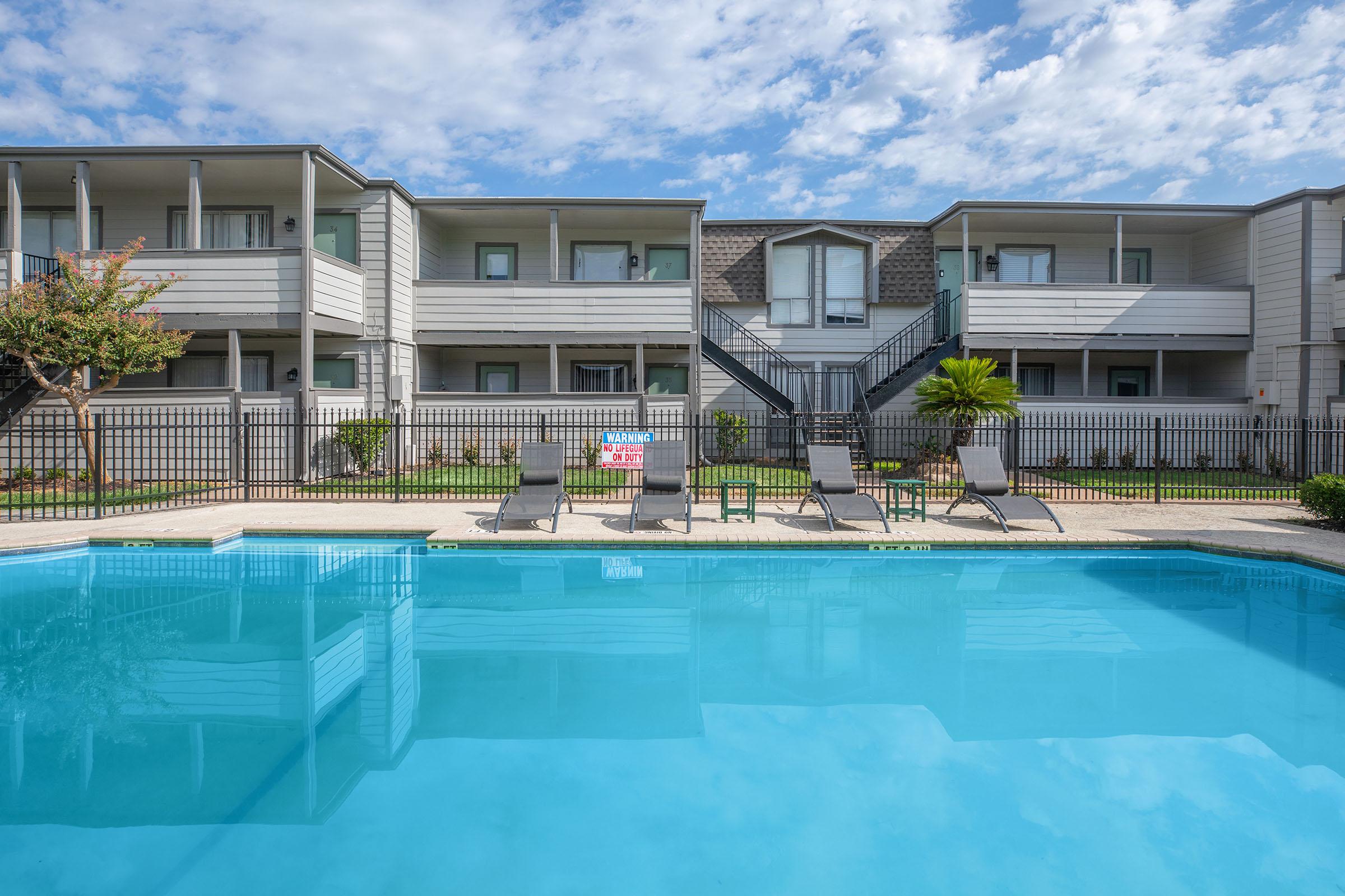 a large pool of water in front of a building