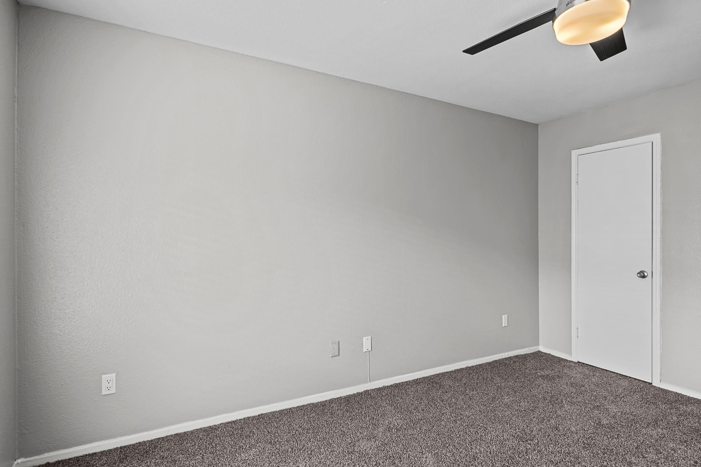 a bedroom with a large mirror