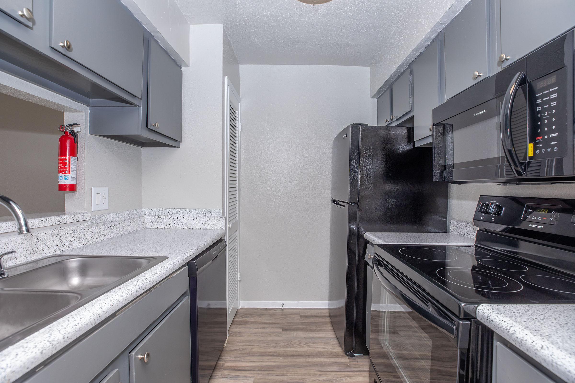 a kitchen with a stove and a sink