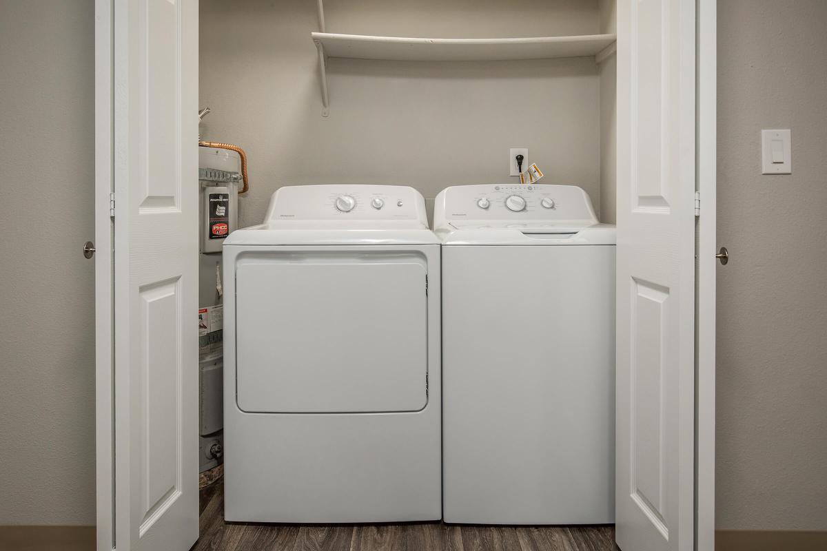 a white refrigerator freezer sitting next to a door