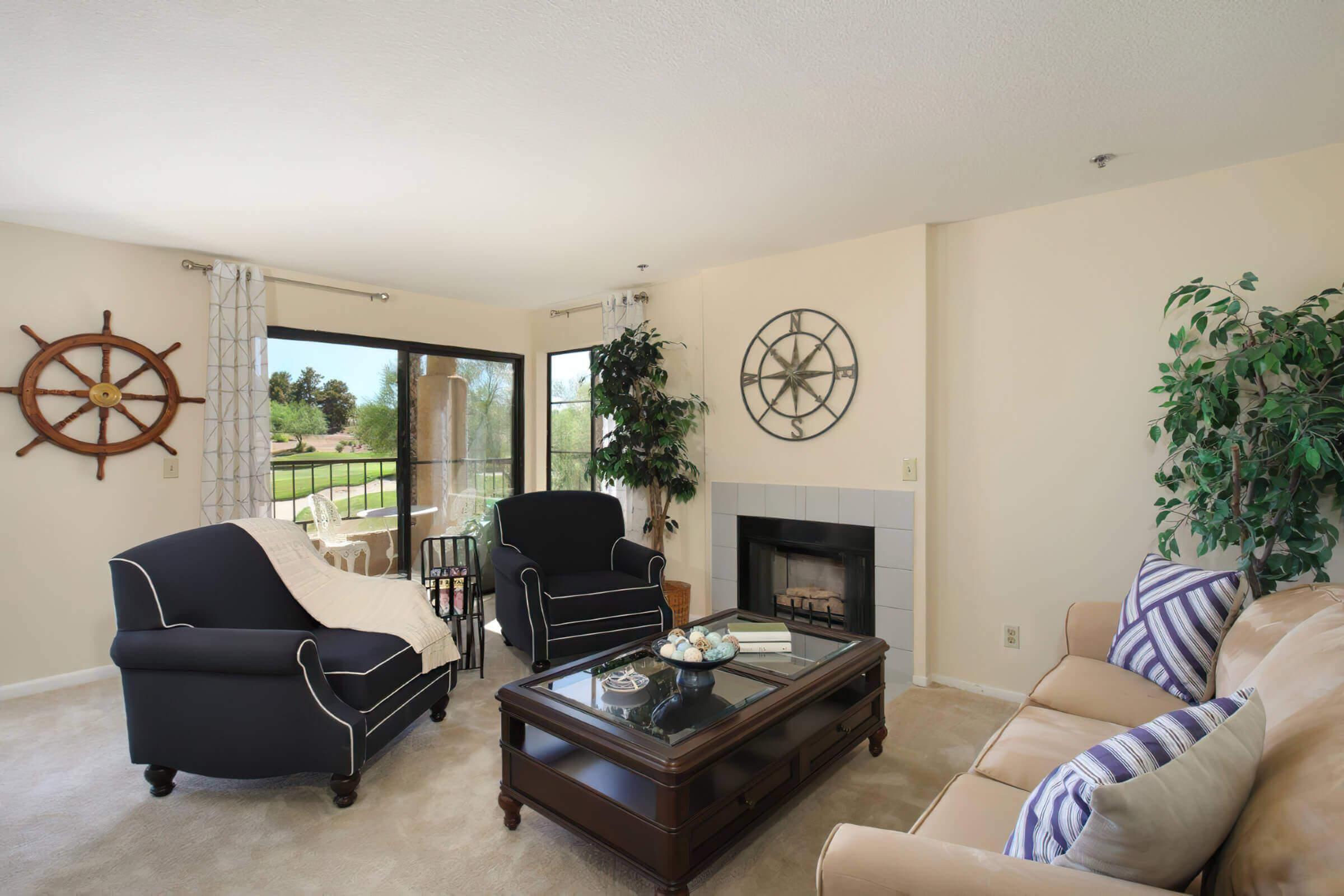 a living room filled with furniture and a flat screen tv