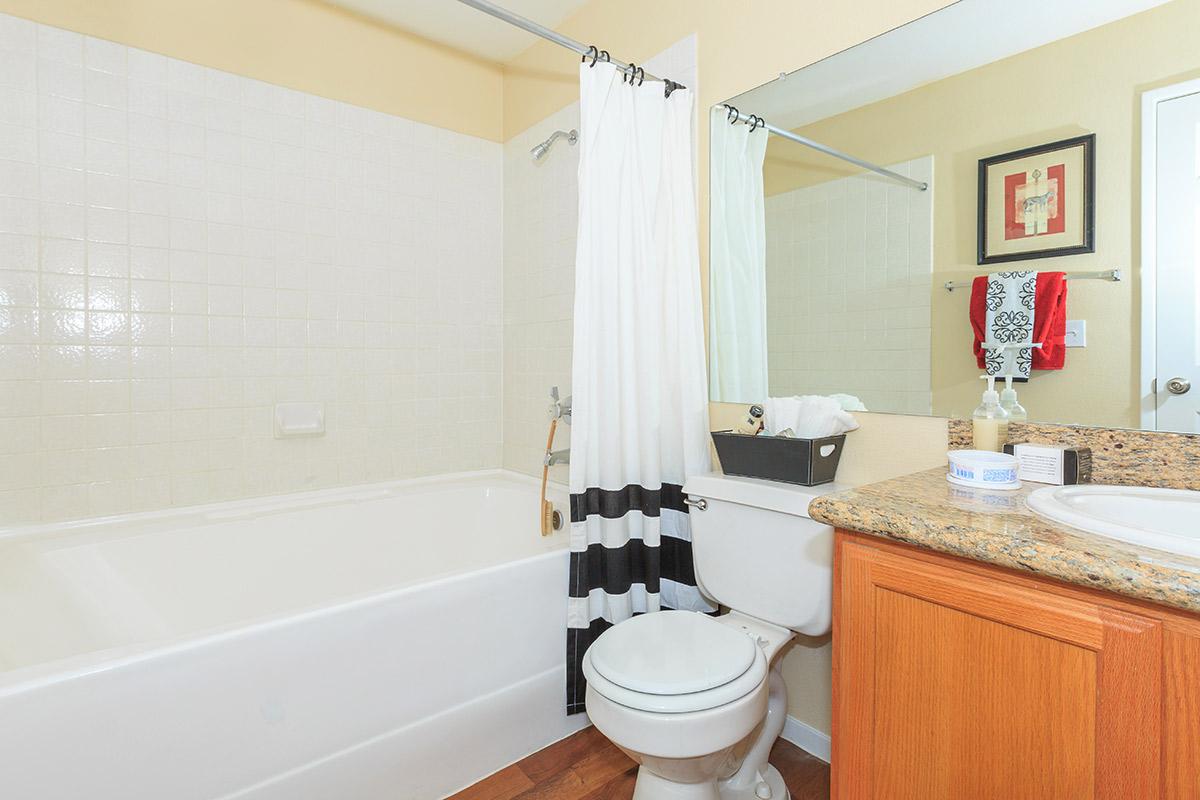 a large white tub sitting next to a sink