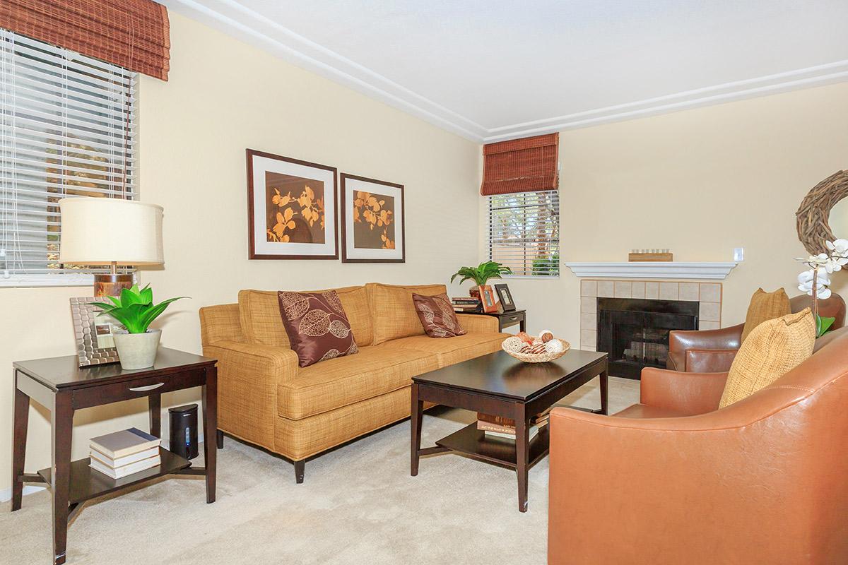 a living room filled with furniture and a table