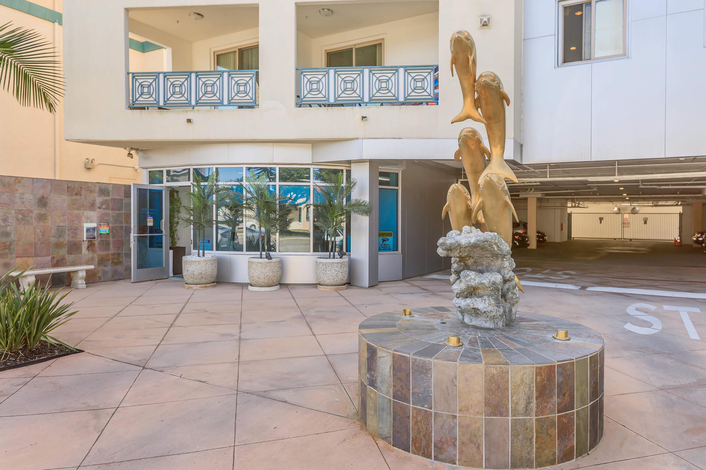 Dolphin sculpture at Del Rey Club Apartments