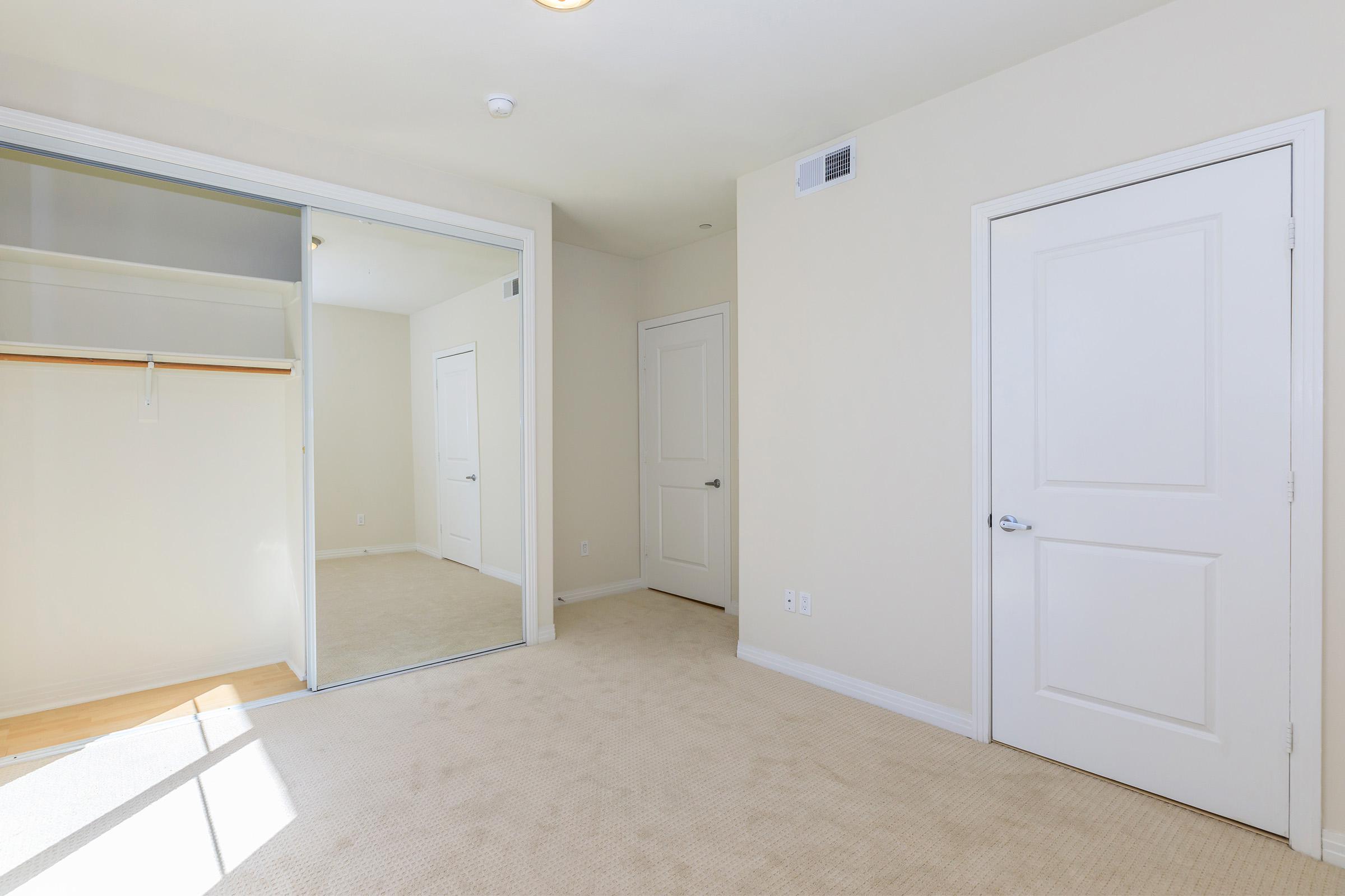 Bedroom with sliding closet doors