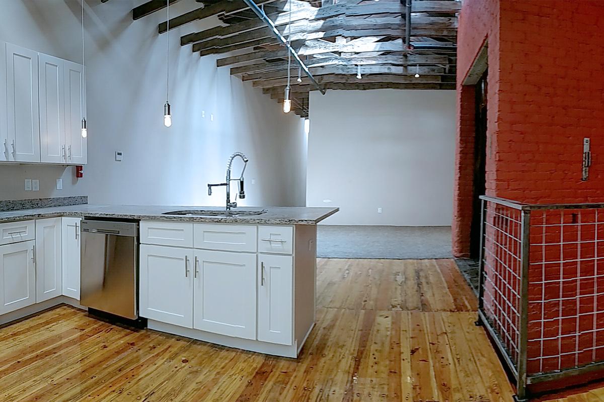 a kitchen with a wooden floor