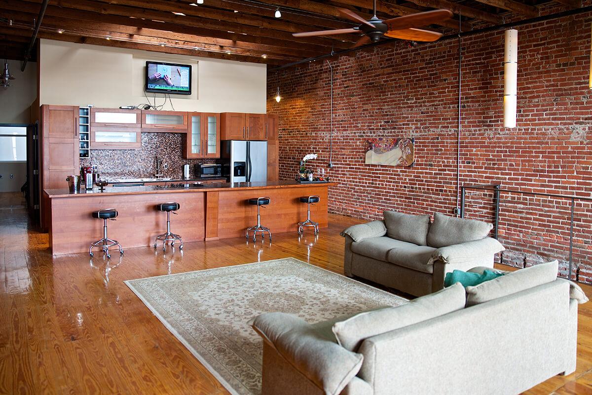 a living room filled with furniture and a fire place