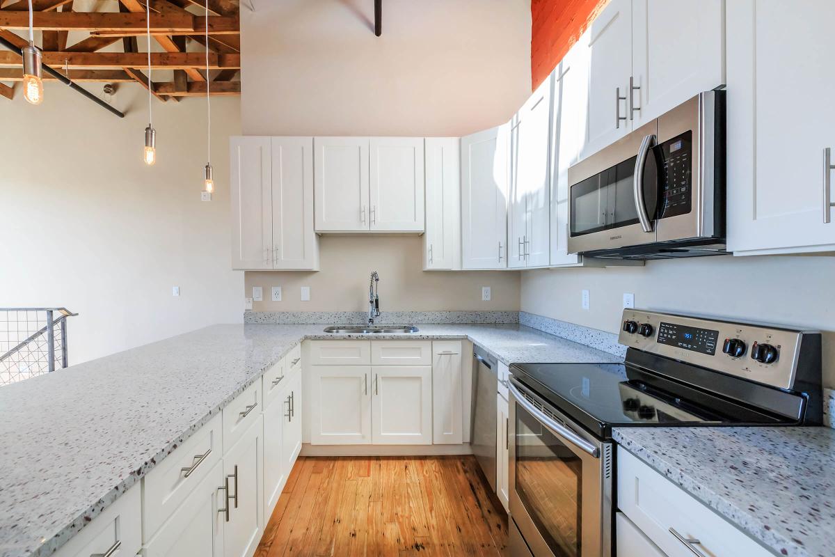 a kitchen with a stove top oven