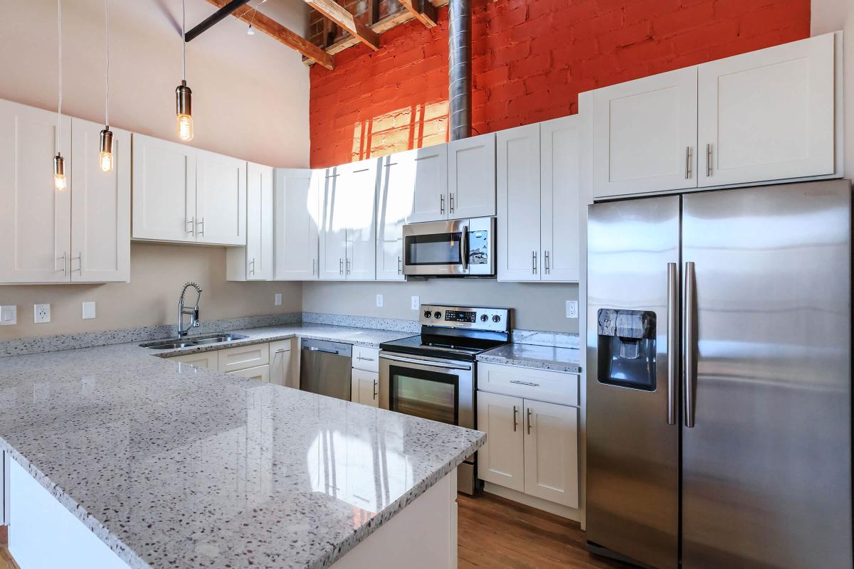 a large kitchen with stainless steel appliances