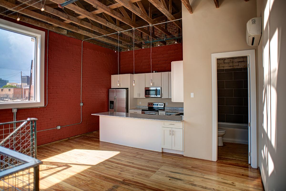 a room filled with furniture and a large window