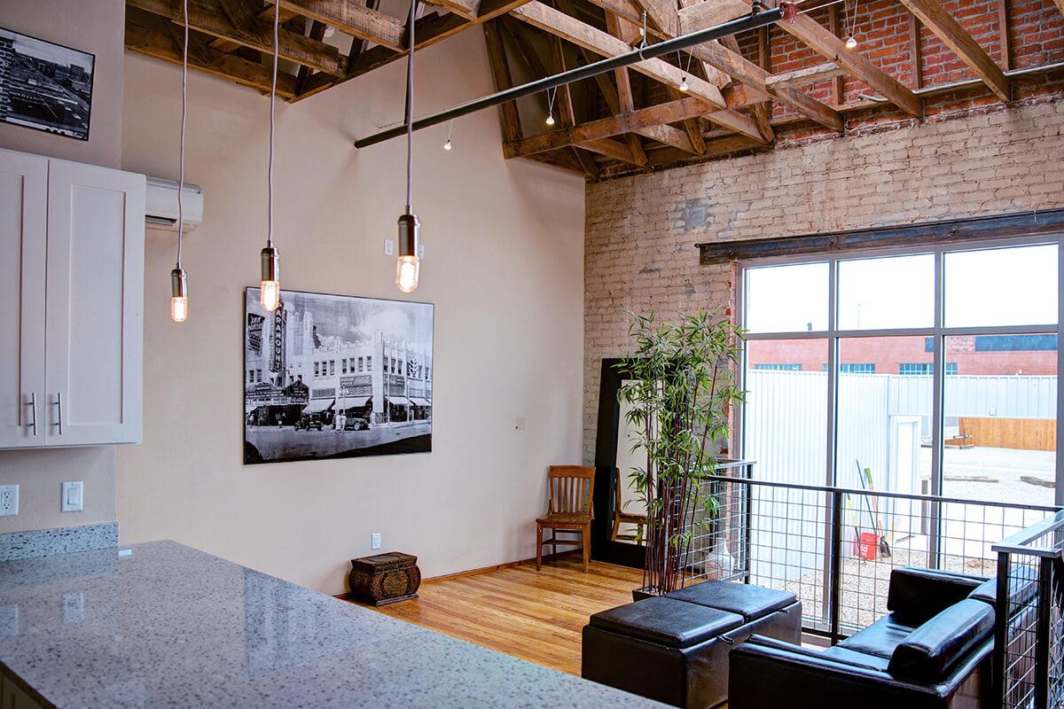 a living room filled with furniture and a large window