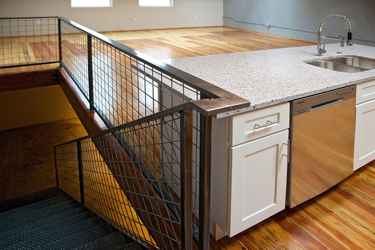 a kitchen with wooden cabinets and a sink