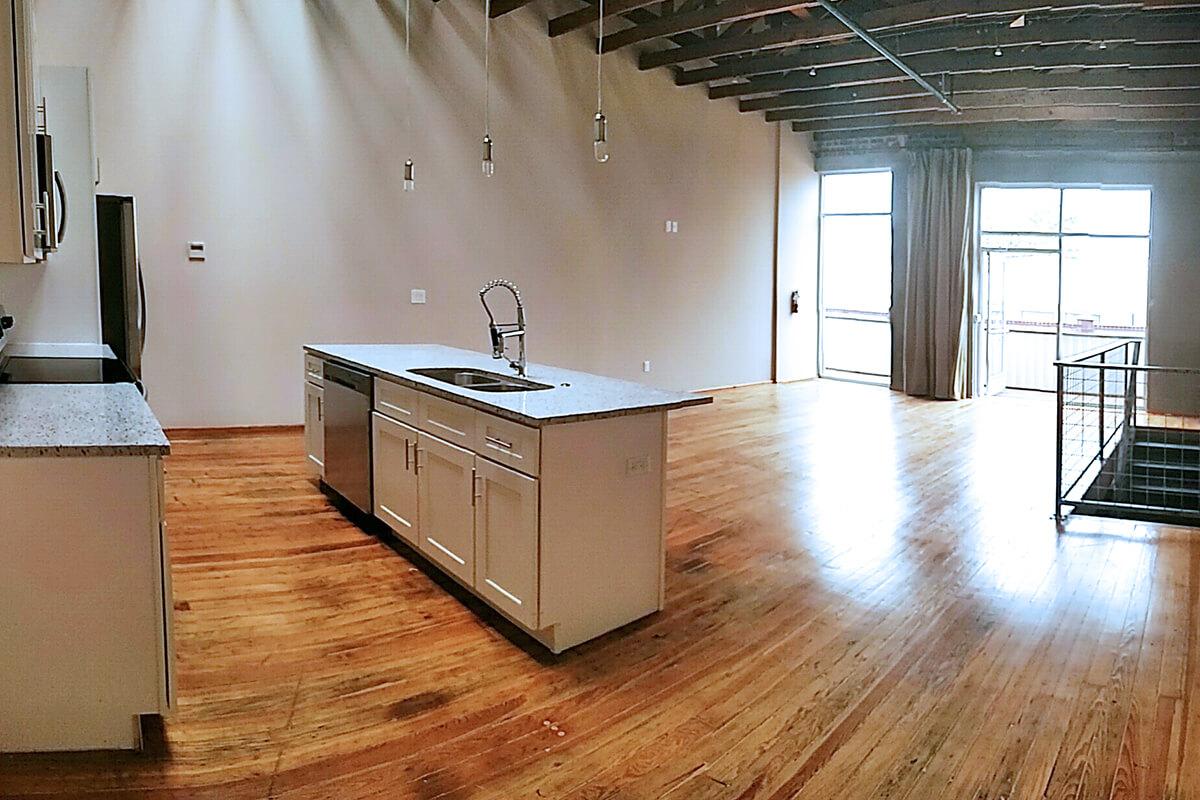 a kitchen with a wood floor