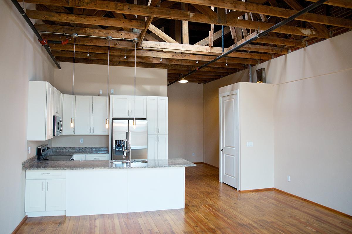 a kitchen with a wood floor