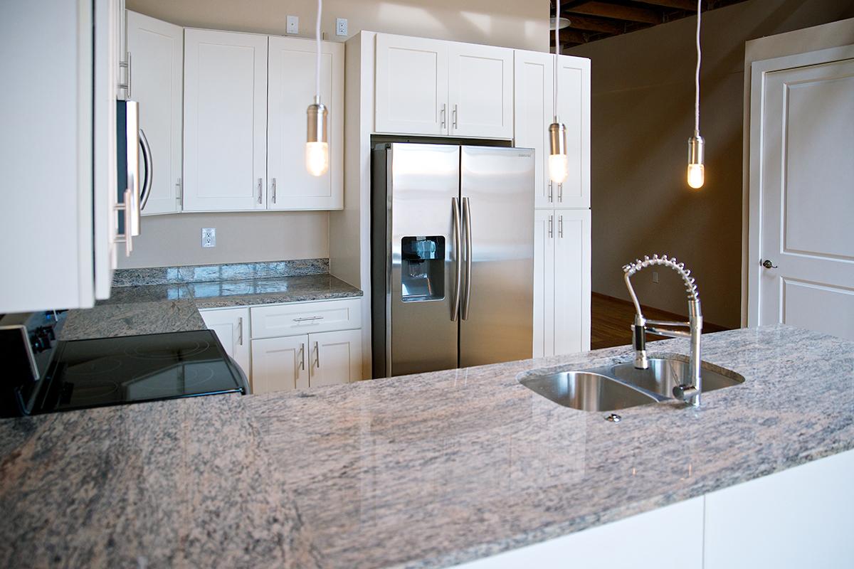 a modern kitchen with stainless steel appliances