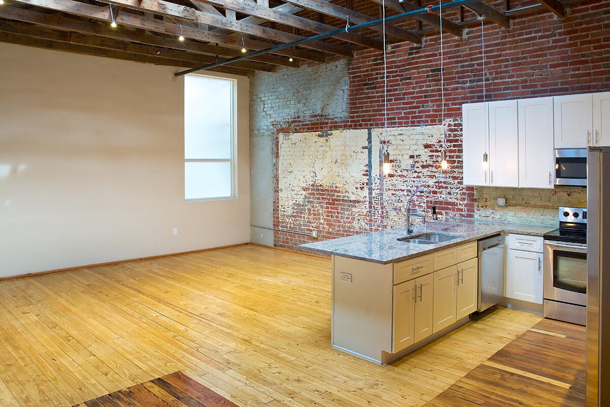 a kitchen with a wooden floor