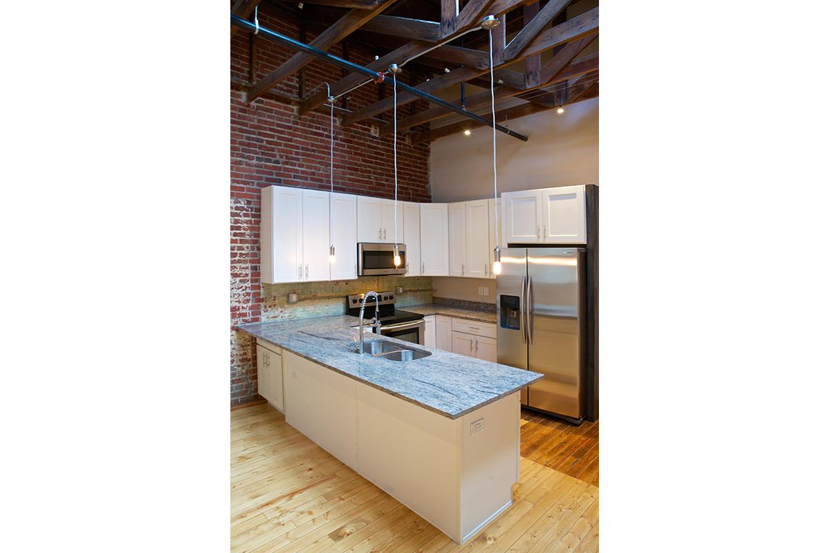 a kitchen with a tile floor