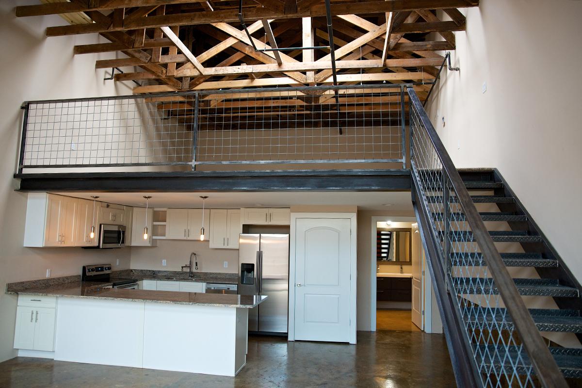 a kitchen with a stove top oven sitting inside of a building