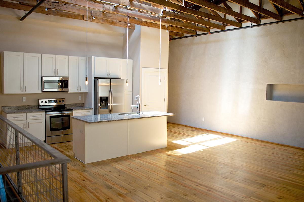 a kitchen with a wood floor