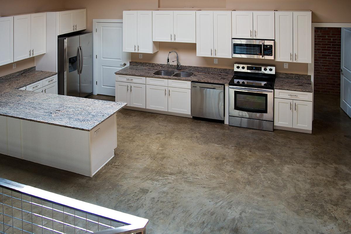 a kitchen with a stove and a sink