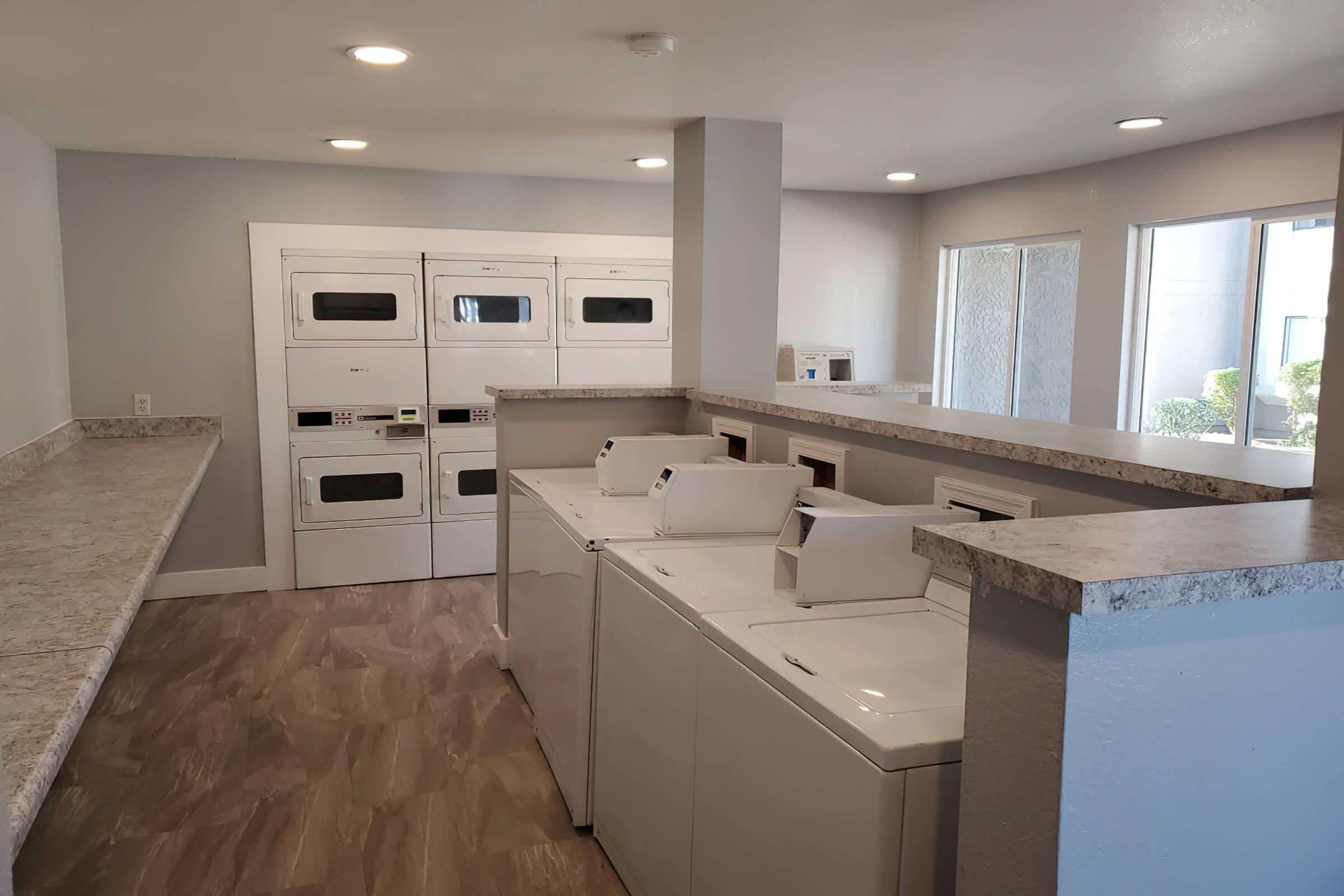 a kitchen with a sink and a microwave