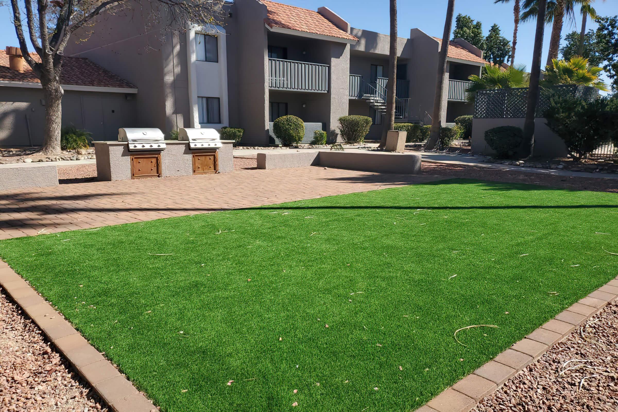 a large lawn in front of a building