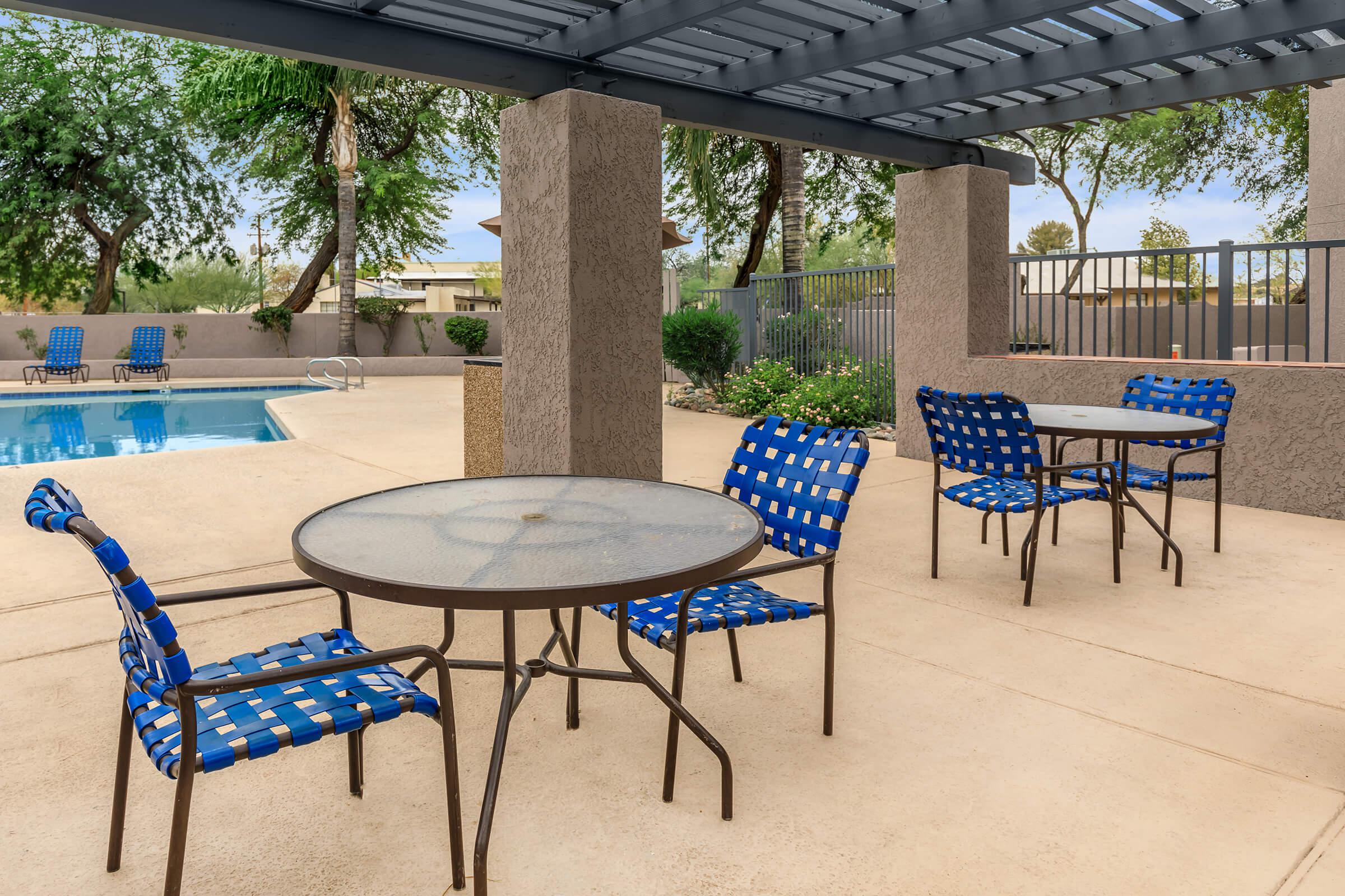 a group of lawn chairs sitting on top of a table