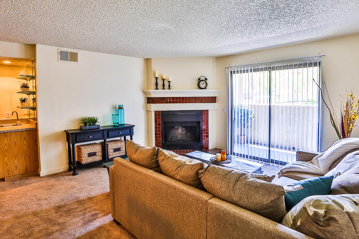 a living room filled with furniture and a flat screen tv