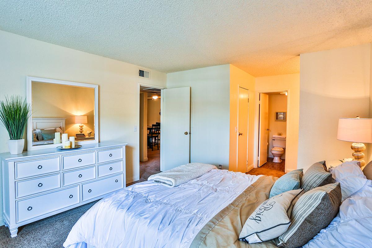 a bedroom with a large bed in a room