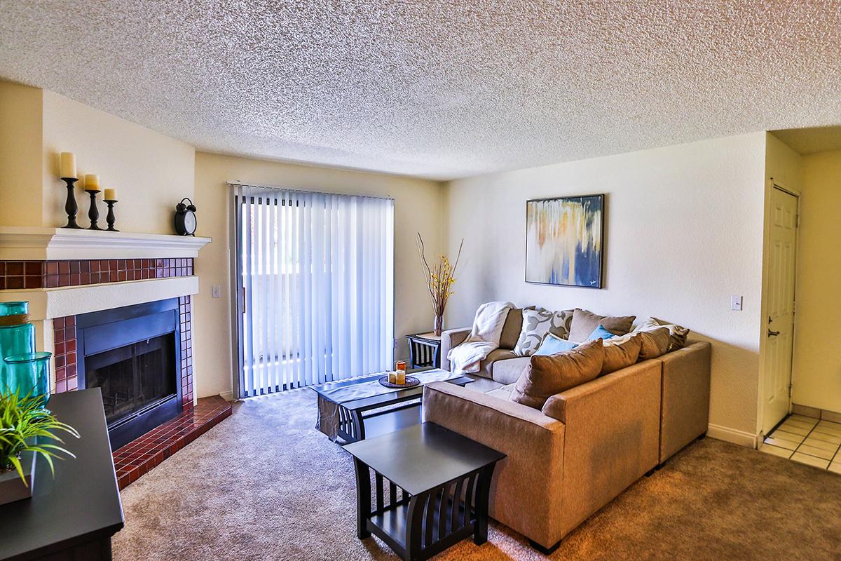 a living room filled with furniture and a flat screen tv