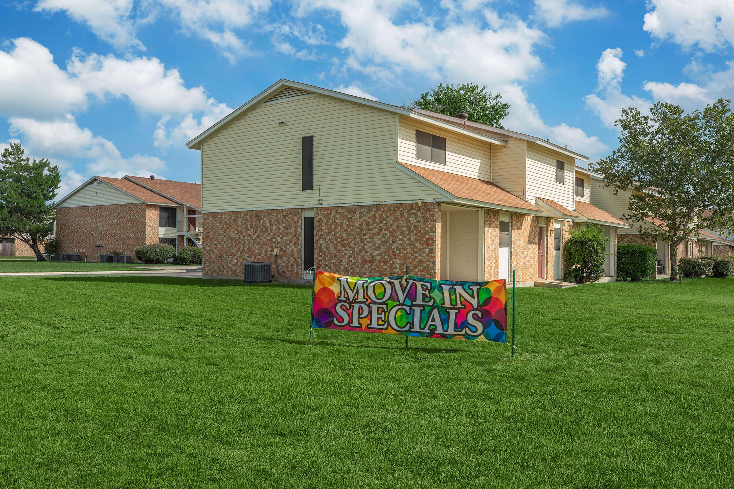 a house that has a kite in front of a building