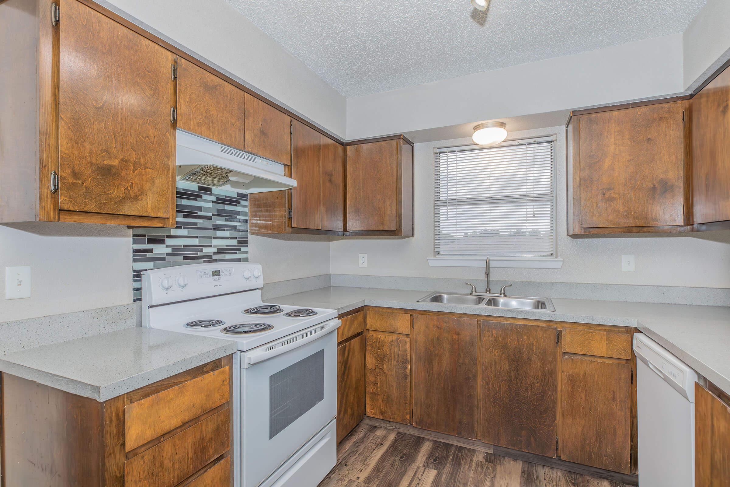 a kitchen with a stove top oven