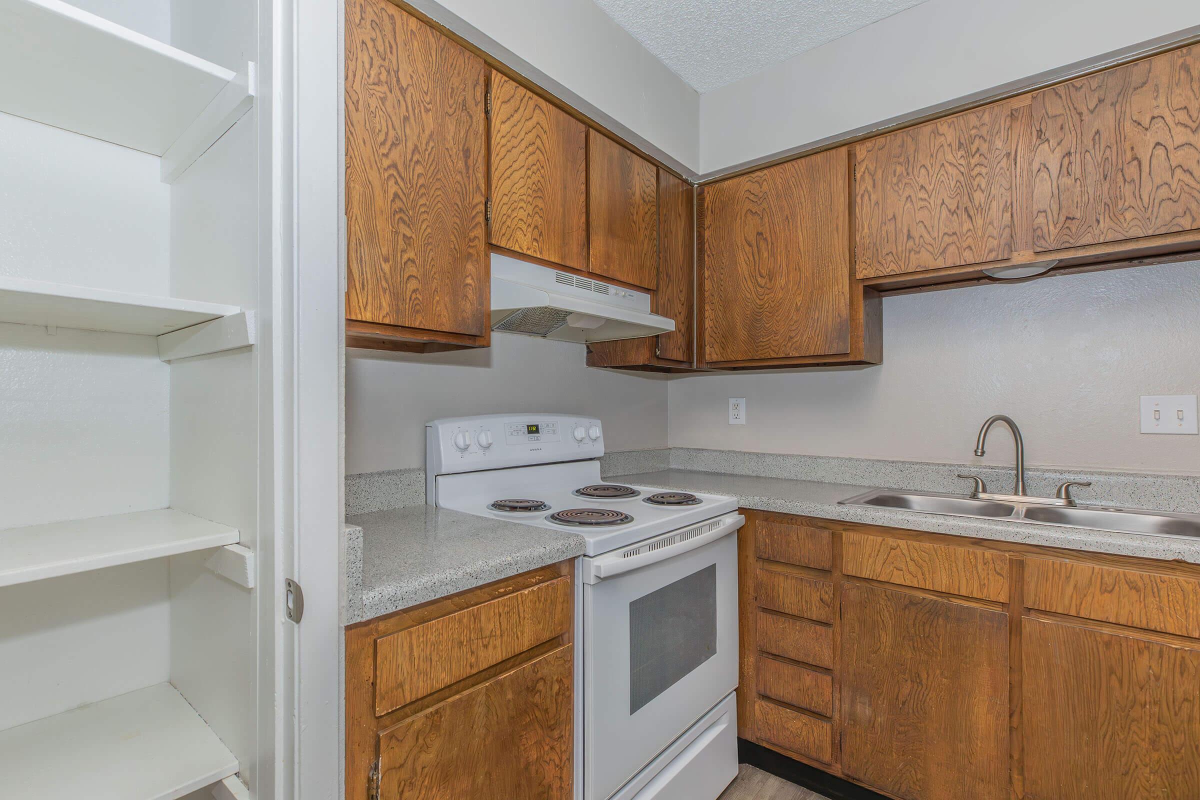 a kitchen with a sink and a microwave