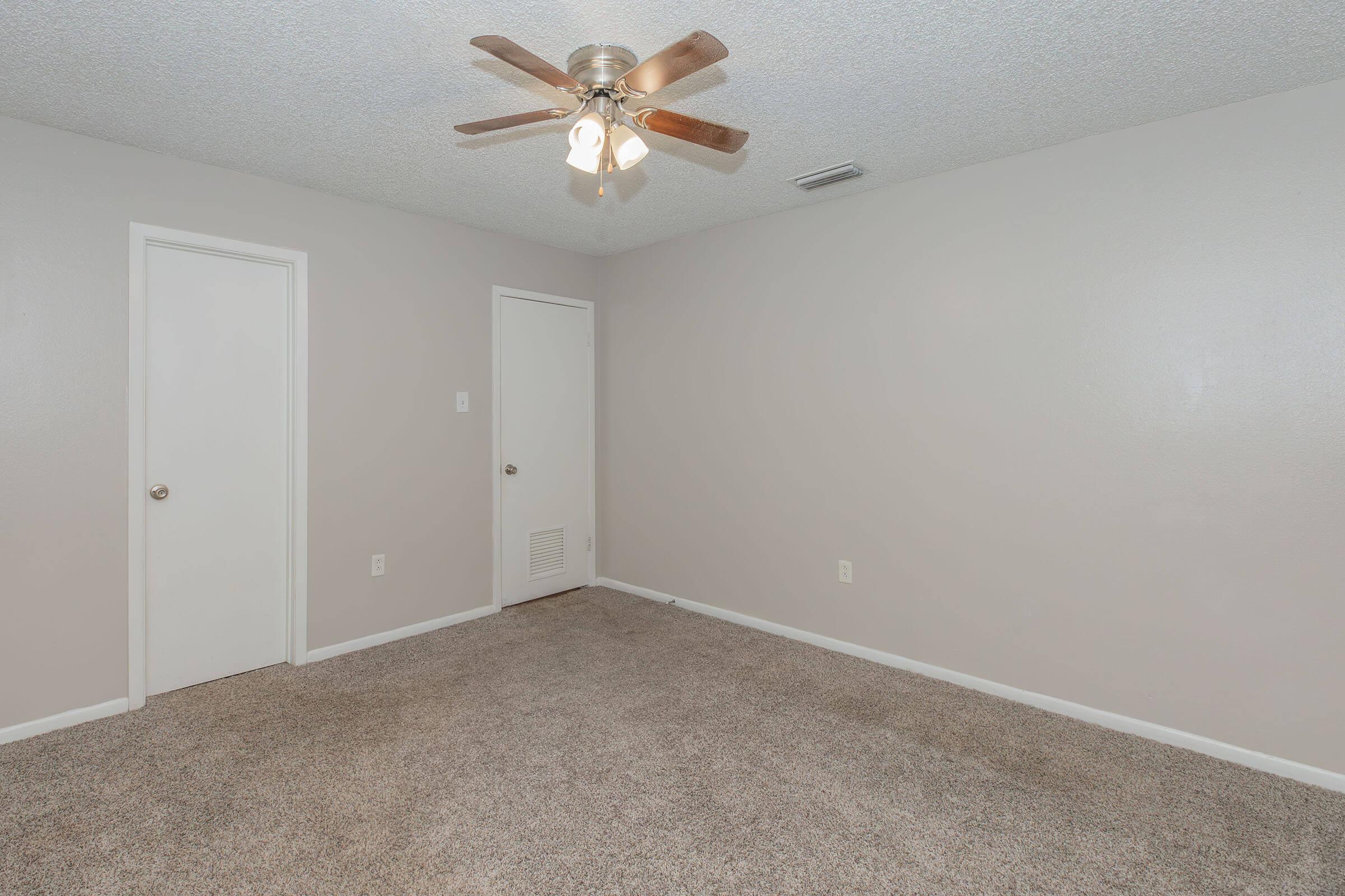 a bedroom with a large mirror