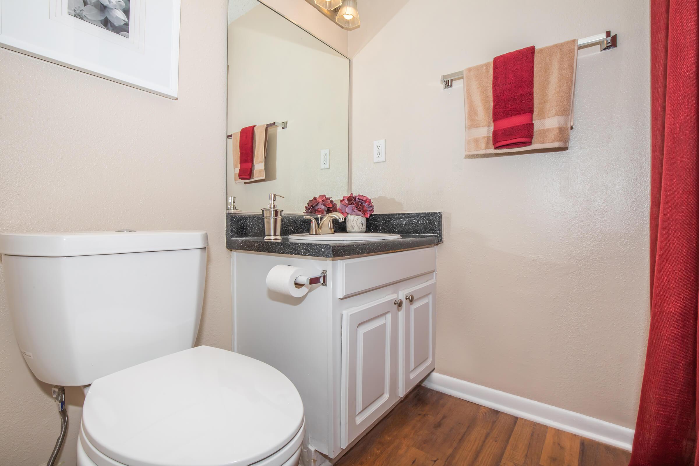 a kitchen with a sink and a mirror