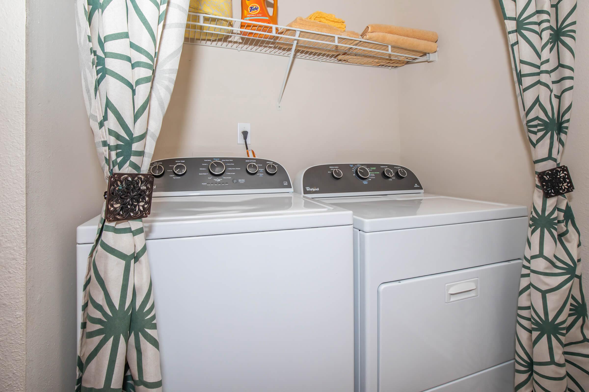 a white refrigerator freezer sitting in a room