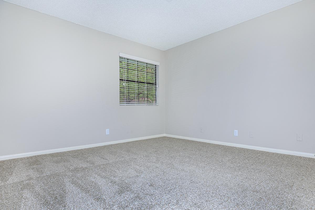 a bedroom with a large window
