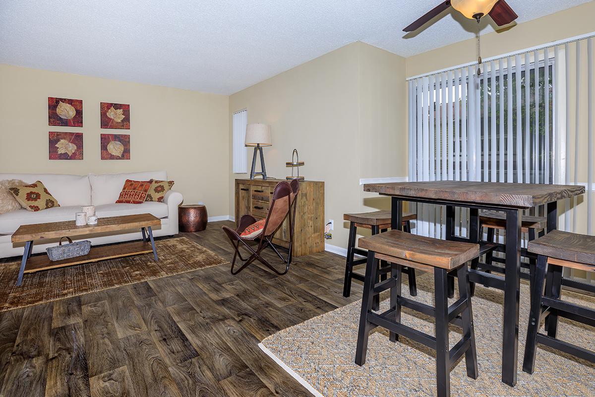 a room filled with furniture on top of a wooden table