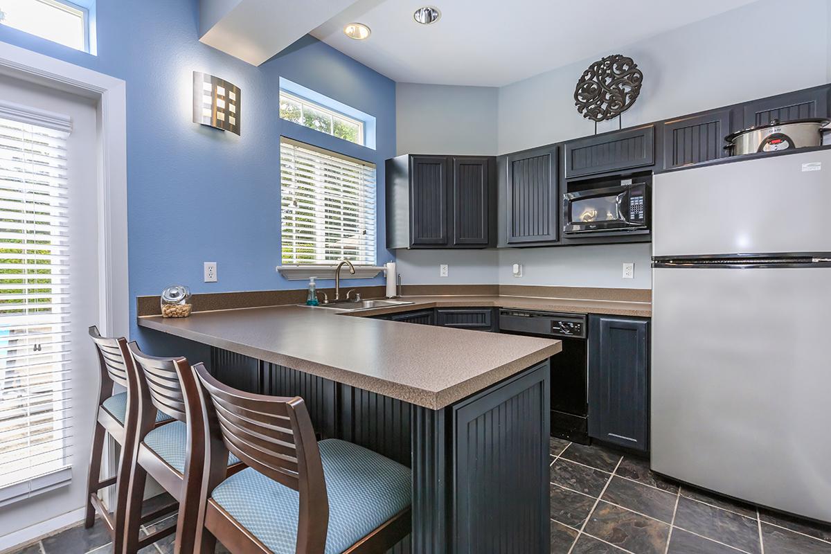 a kitchen with a dining room table
