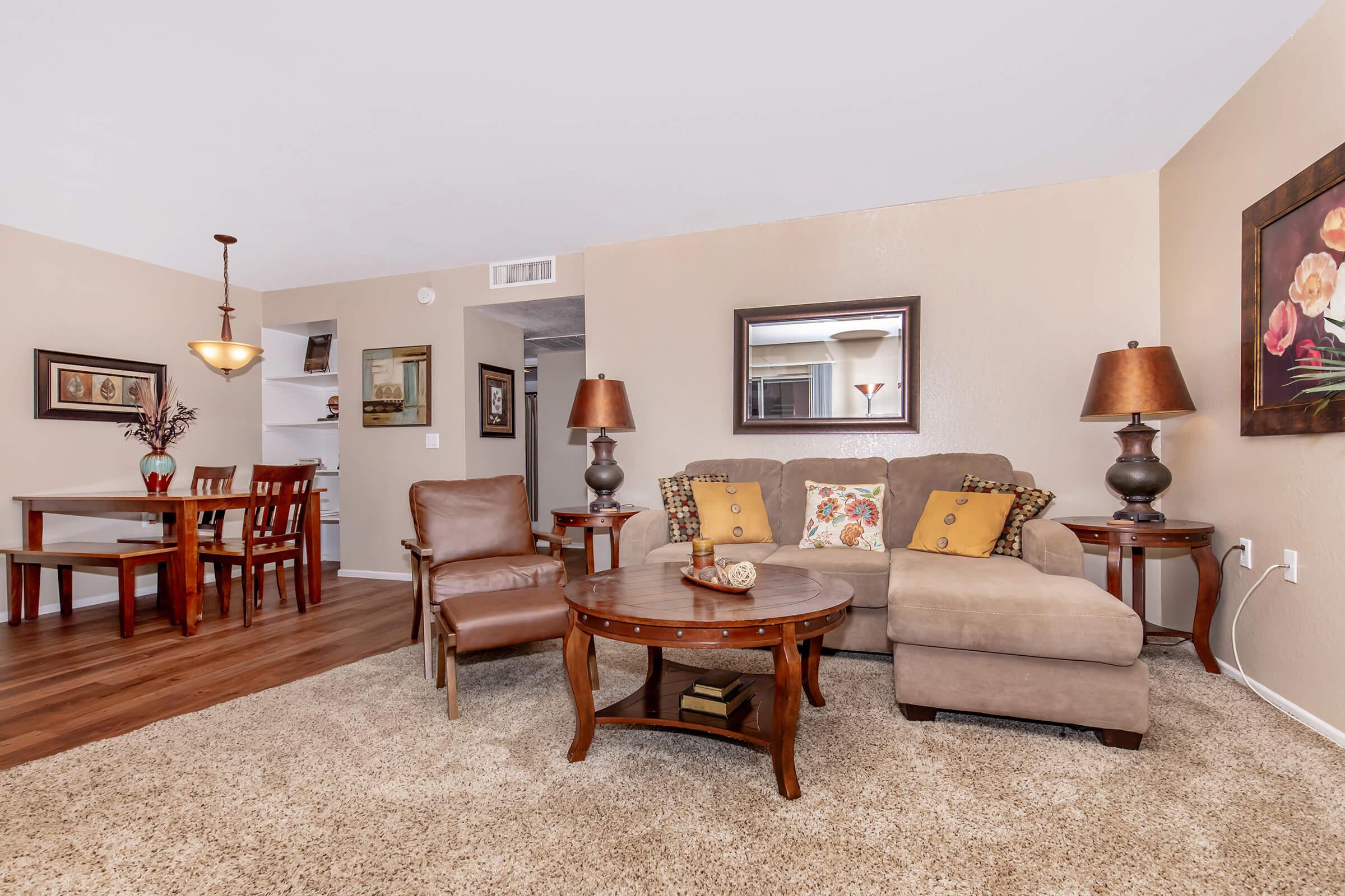 a living room filled with furniture and a table