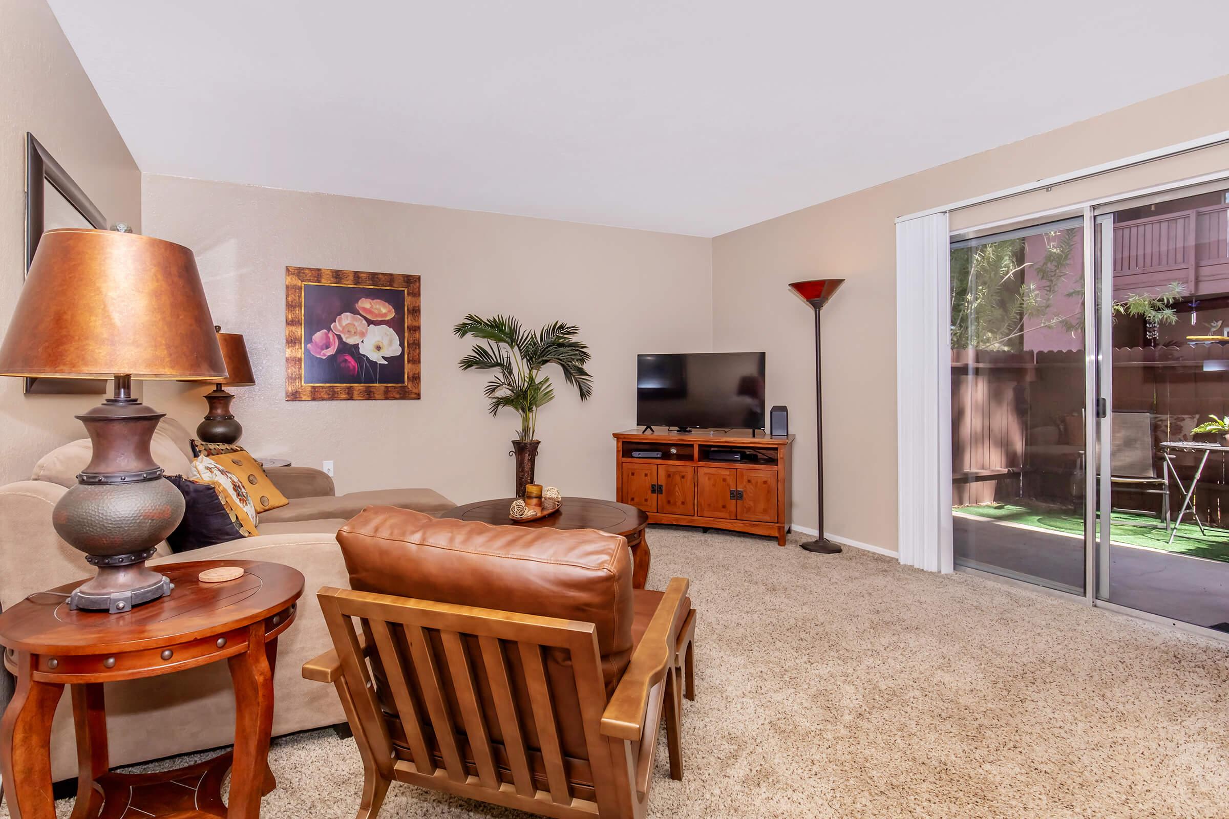 a living room filled with furniture and a fireplace