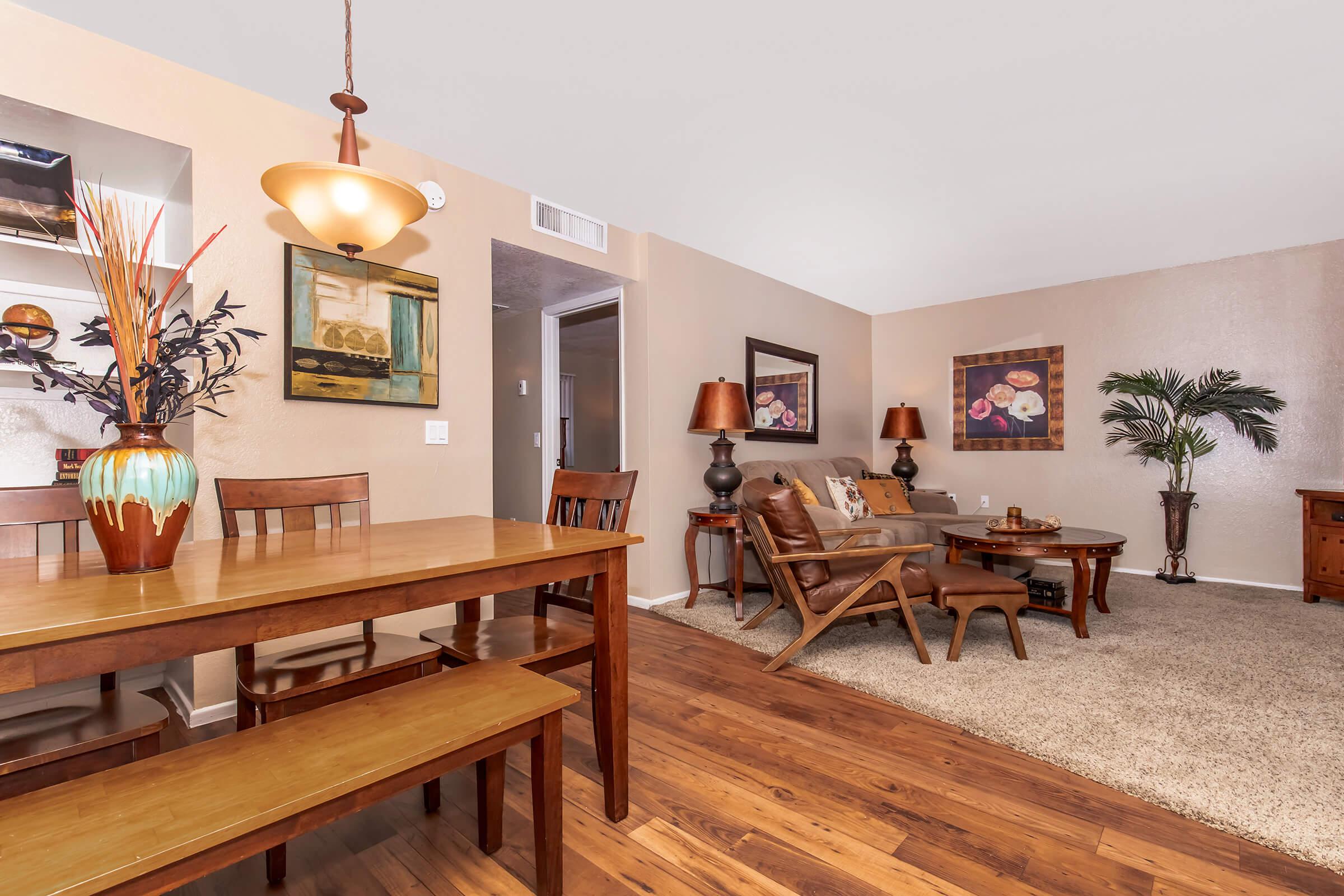 a living room filled with furniture on top of a wooden table