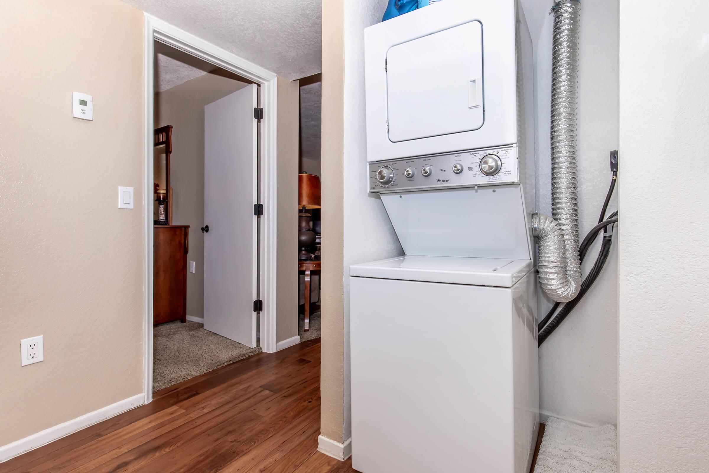 a refrigerator freezer sitting inside of a building