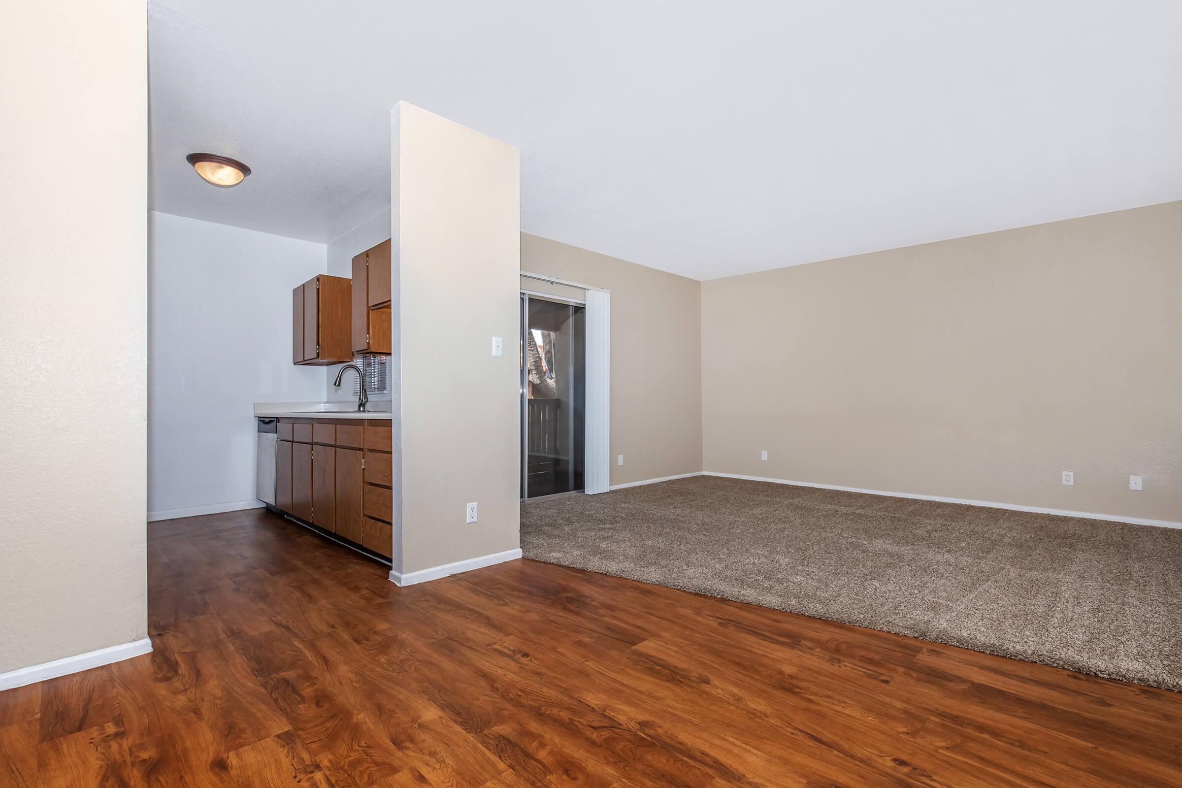 a large empty room with a wooden floor