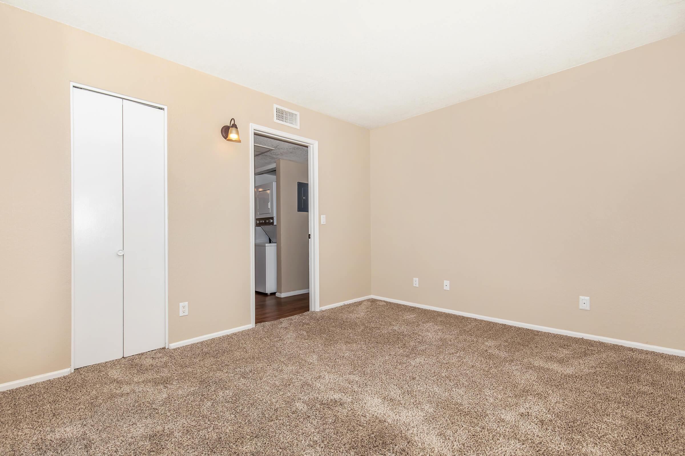 a bedroom with a large mirror