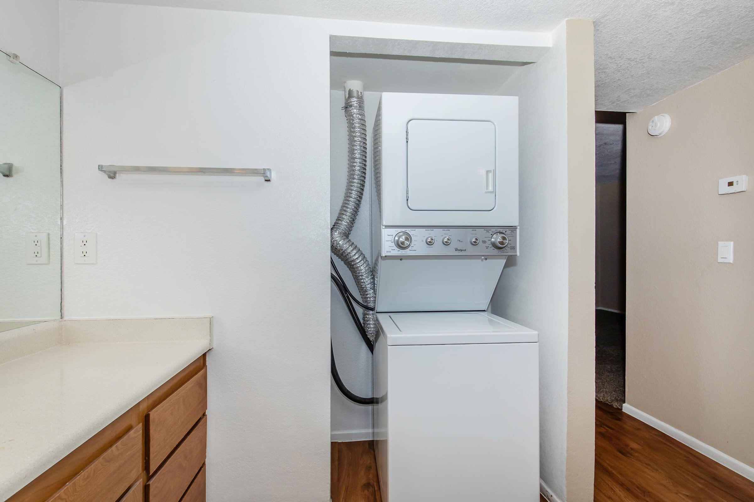 a kitchen with a sink and a refrigerator