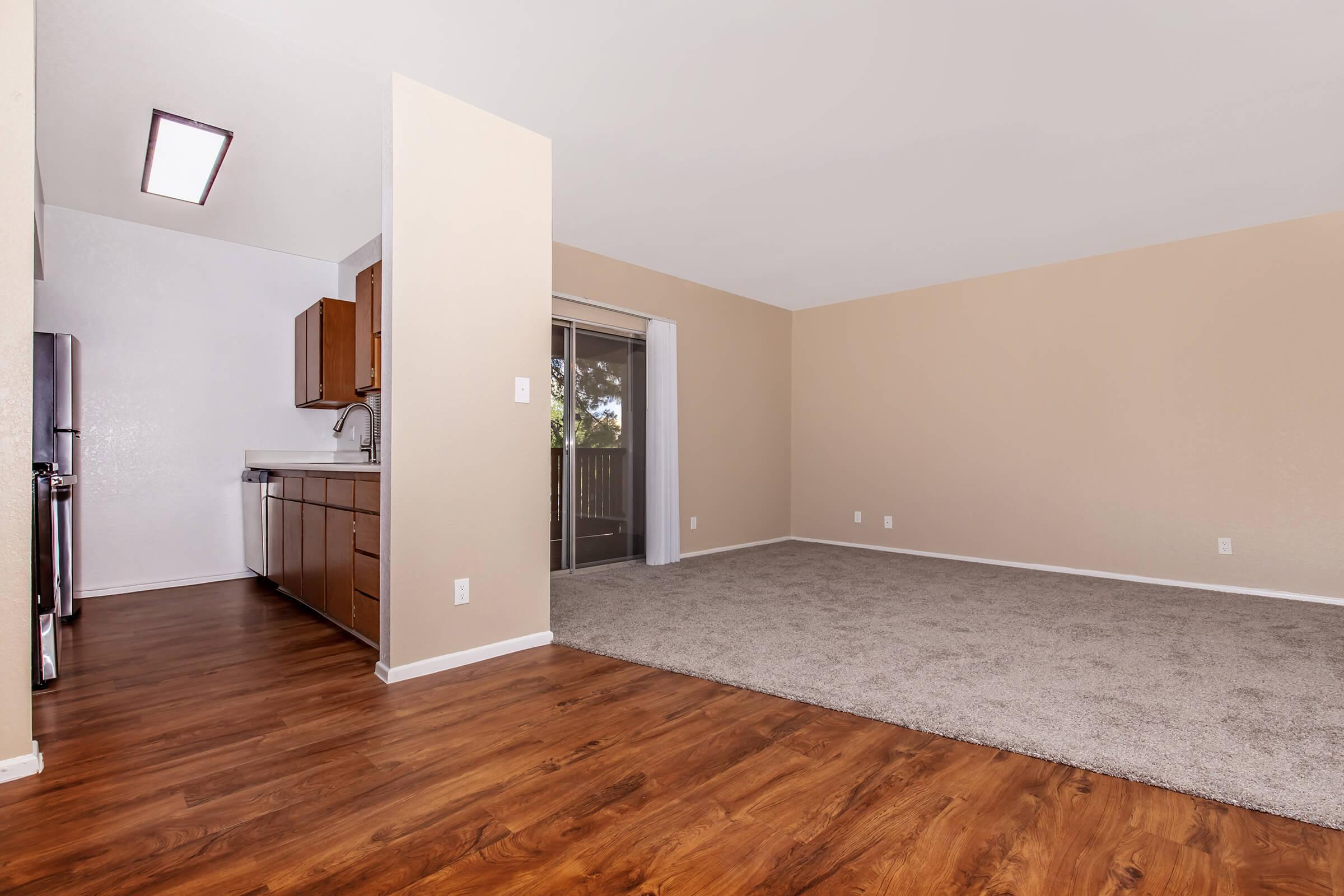 a large empty room with a wooden floor