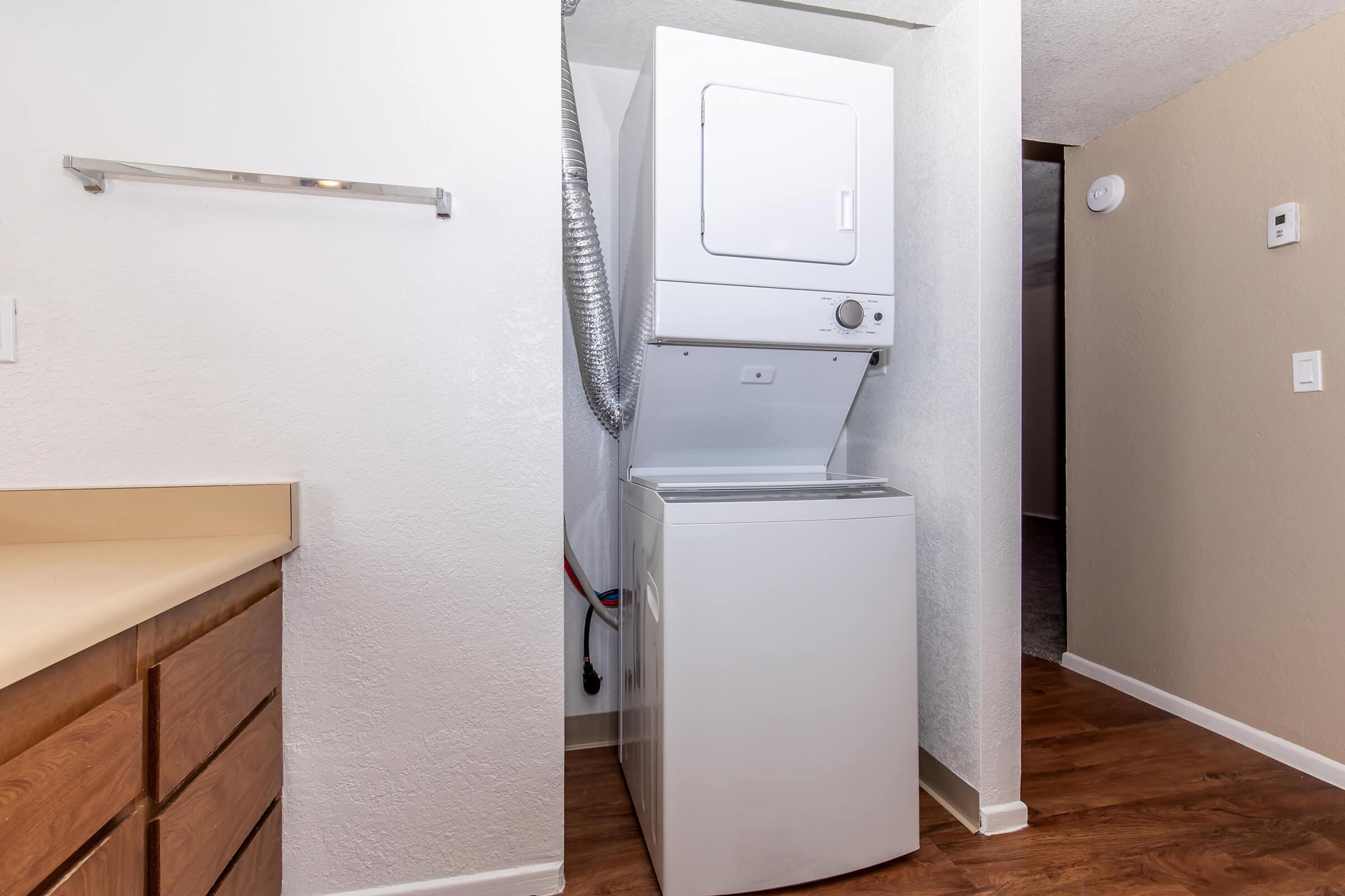 a kitchen with a sink and a refrigerator