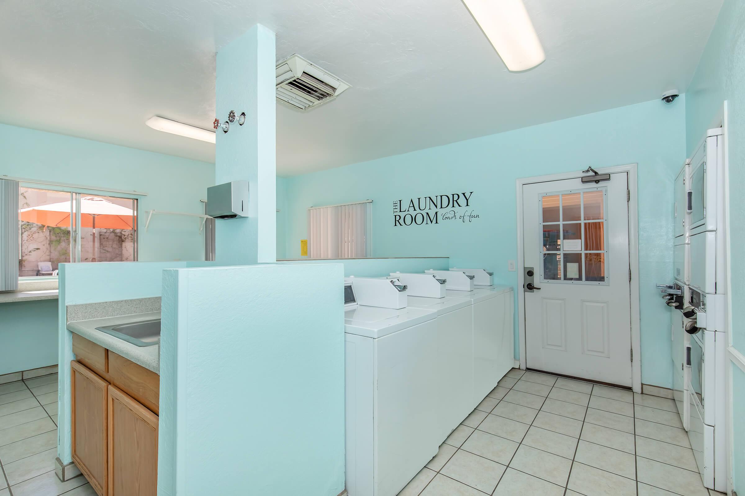 a kitchen with a sink and a refrigerator